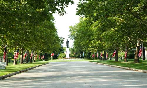 After entering Resurrection Cemetery, one can continue traveling down the main boulevard, shown here, with the Resurrection of the Christ monument at the end.