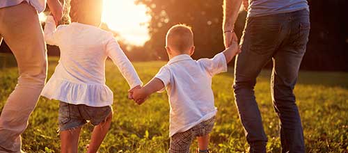 family with small children holding hands Family with small children holding hands - Preplanning Options